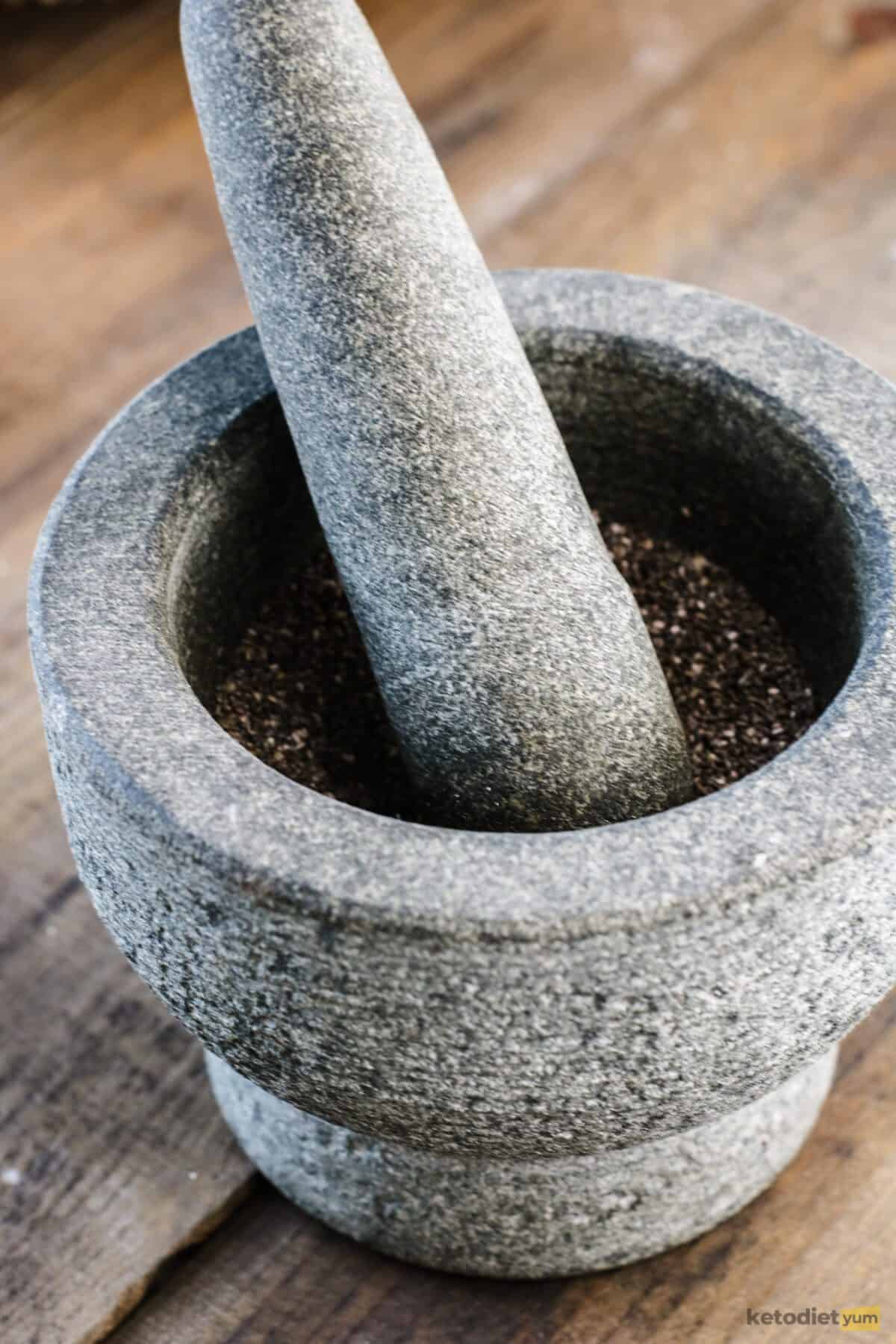 Grinding chia seeds using a mortar and pestle