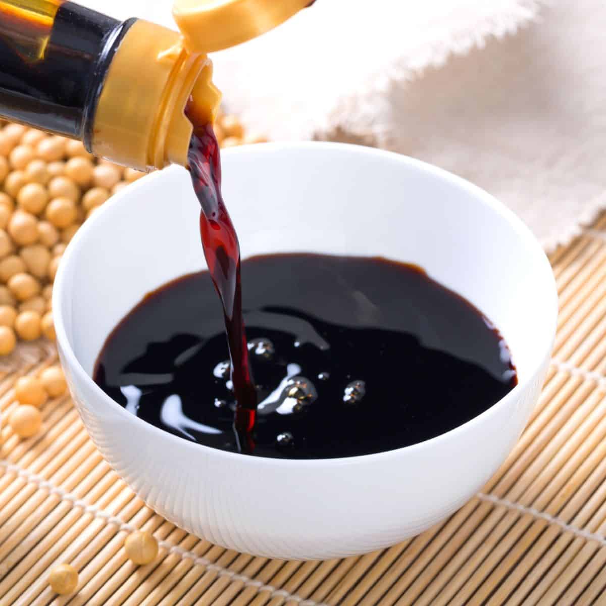 soy sauce poured into a small white bowl