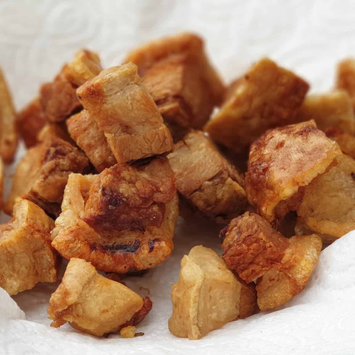 Crispy pork rinds in baking paper