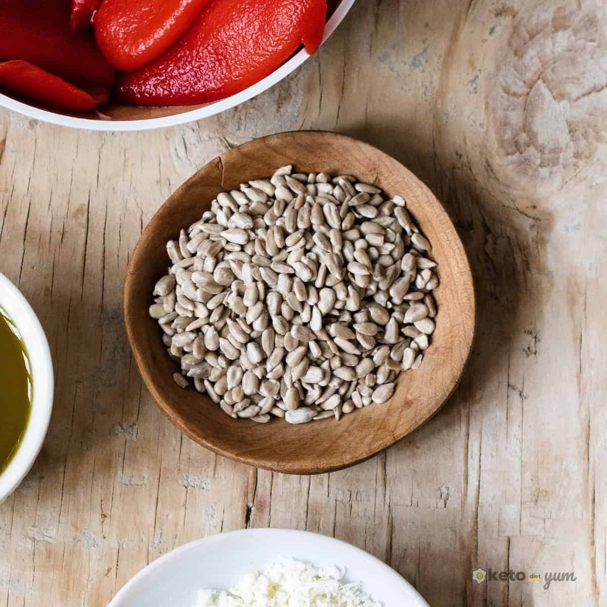 Sunflower seeds in a wooden bowl on a rustic table